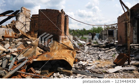 View to destroyed residential buildings at Kharkivska oblast. Ruined houses after bomb attacks on ukrainian territory from russia army. Consequences of russian invasion of Ukraine. Slow motion 123448430