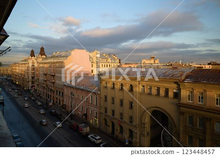 A beautiful cityscape at dusk showcasing historic architecture along with moving cars 123448457