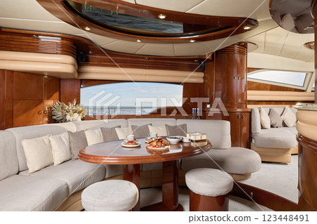 Experience the luxurious yacht interior with its exquisite and elegant dining area Experience the luxurious yacht interior with its exquisite and elegant dining area 123448491