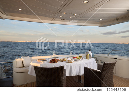 Discover an Elegant Dining Experience on a Luxury Yacht with a Stunning Oceanview Discover an Elegant Dining Experience on a Luxury Yacht with a Stunning Oceanview 123448506