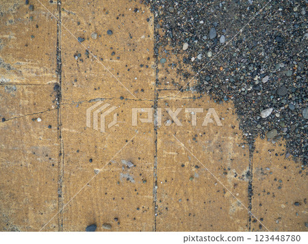 Background of brown tiles and small pebbles. Solid material pattern. Pebbles on tiles. Sidewalk surface in the park. Cracks. Background of brown tiles and small pebbles. Solid material pattern. Pebbles on tiles. Sidewalk surface in the park. Cracks. 123448780