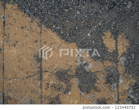 Background of brown tiles and small pebbles. Solid material pattern. Pebbles on tiles. Sidewalk surface in the park.  Near the sea coast 123448781