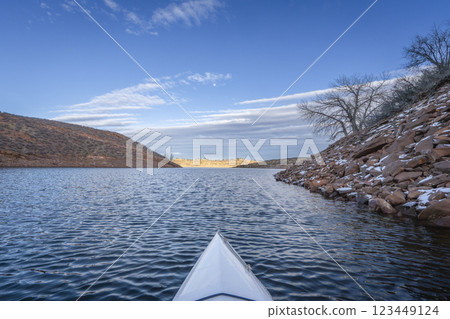 winter sunset kayaking or canoeing on Horsetooth Reservoir near Fort Collins, Colorado - POV paddler perspective winter sunset kayaking or canoeing on Horsetooth Reservoir near Fort Collins, Colorado - POV paddler perspective 123449124