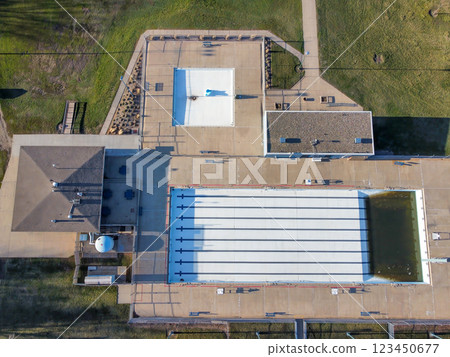 Drone view of an empty and drained winterized swimming pool  123450677