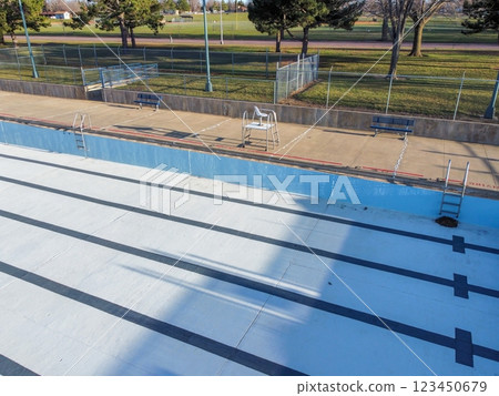 Drone view of an empty and drained winterized swimming pool  123450679