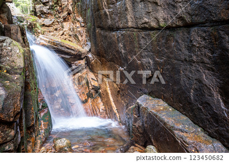 Long exposure Cascading waterfall at Flume Gorge in the Franconia Notch State Park 123450682