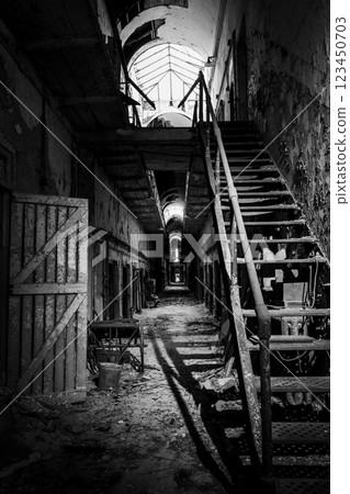 decrepit cell block and stairs leading to upper level at Eastern State Penitentiary historic site. 123450703