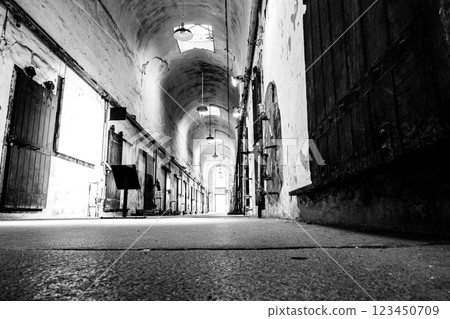 Floor level point of view of a lit cellblock of Eastern State Penitentiary historic site. 123450709