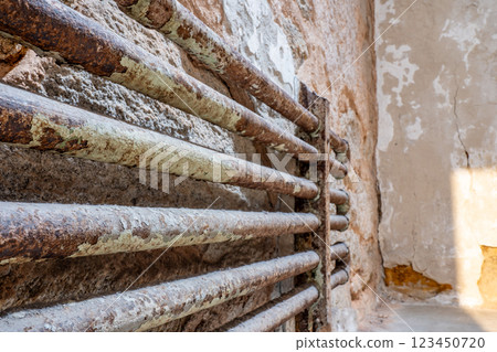Aged cell steam radiator at Eastern State Penitentiary historic site. 123450720