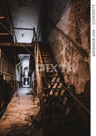 decrepit cell block and stairs leading to upper level at Eastern State Penitentiary historic site. decrepit cell block and stairs leading to upper level at Eastern State Penitentiary historic site. 123450773