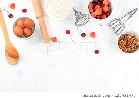 Kitchen background, cooking, Strawberry cherry pie recipe. Eggs, flour, sugar, strawberries and honey, top view, flat lay. Bakery background, modern bakery concept, selective focus 123451473