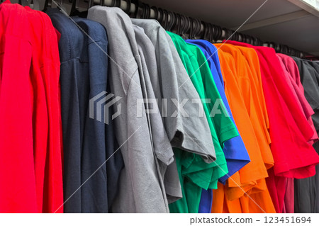 Vibrant colors of fabric lined neatly in a retail clothing store 123451694