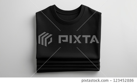 Black folded sweatshirt on a neutral background showcasing minimalist design 123452886