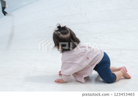 [Infants crawling on giant playground equipment] 123453465
