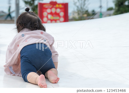 [Infants crawling on giant playground equipment] 123453466