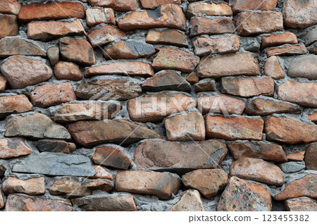 Texture of weathered brown stone wall 123455382