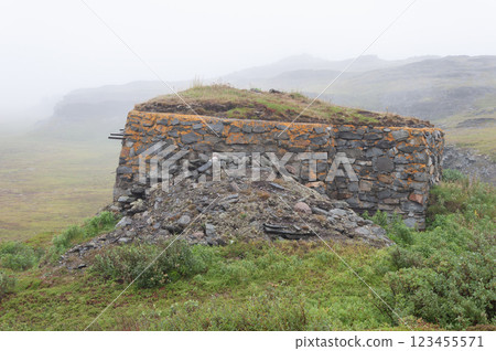 Old abandoned stone pillbox in tundra, foggy morning Old abandoned stone pillbox in tundra, foggy morning 123455571