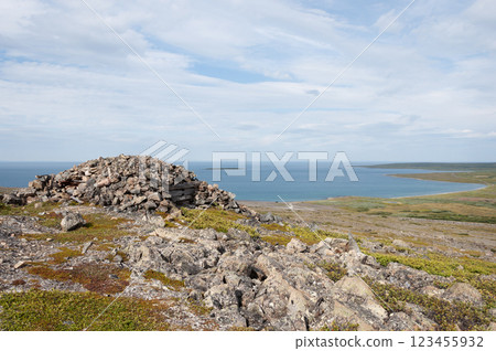 Old abandoned stone pillbox at seashore 123455932