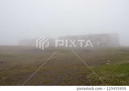 Abandoned military settlement in tundra, heavy fog Abandoned military settlement in tundra, heavy fog 123455939