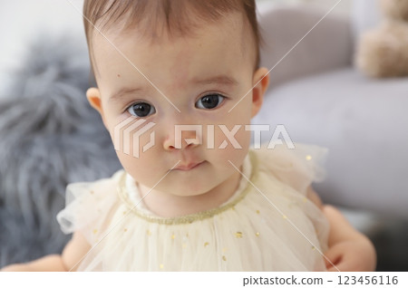 Baby staring straight ahead with big eyes 123456116