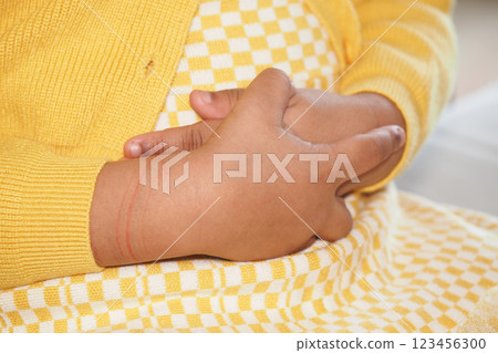 Child experiencing discomfort while holding stomach at home 123456300