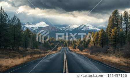 A long road with a mountain range in the background 123457126