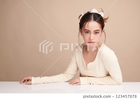 Beautiful young asian woman with clean fresh skin on beige background, Face care, Facial treatment, Cosmetology, beauty and spa, Asian women portrait. 123457878