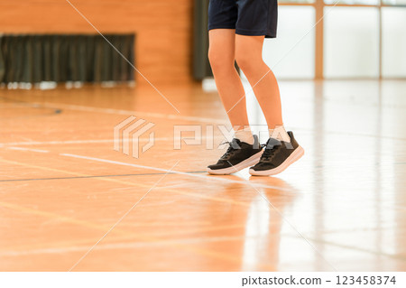 Feet of female students exercising in a gym 123458374