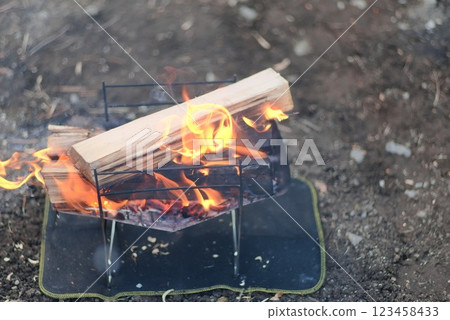 Burning charcoal at a campsite - bonfire scene - Burning charcoal at a campsite - bonfire scene - 123458433
