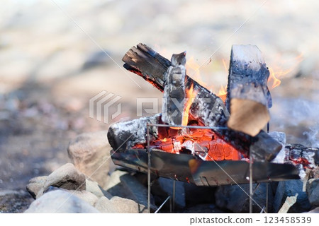 Burning charcoal at a campsite - bonfire scene - Burning charcoal at a campsite - bonfire scene - 123458539