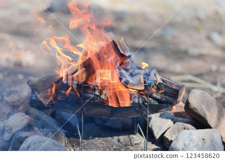 Burning charcoal at a campsite - bonfire scene - 123458620