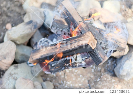 Burning charcoal at a campsite - bonfire scene - 123458621