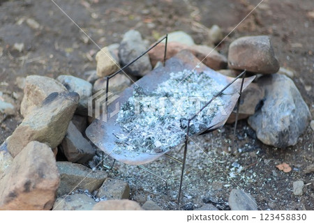 A camping scene with firewood burning in a bonfire and a lingering aftertaste A camping scene with firewood burning in a bonfire and a lingering aftertaste 123458830