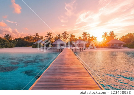Amazing sunset panorama at Maldives. Luxury resort villas seascape with soft led lights under colorful sky. Beautiful twilight sky and colorful clouds. Beautiful beach background for vacation holiday 123458928