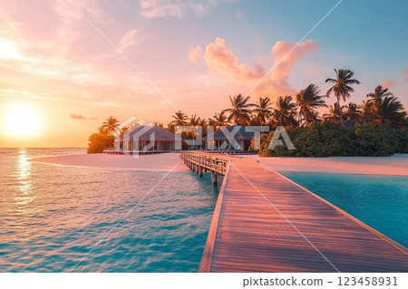 Amazing sunset panorama at Maldives. Luxury resort villas seascape with soft led lights under colorful sky. Beautiful twilight sky and colorful clouds. Beautiful beach background for vacation holiday Amazing sunset panorama at Maldives. Luxury resort villas seascape with soft led lights under colorful sky. Beautiful twilight sky and colorful clouds. Beautiful beach background for vacation holiday 123458931