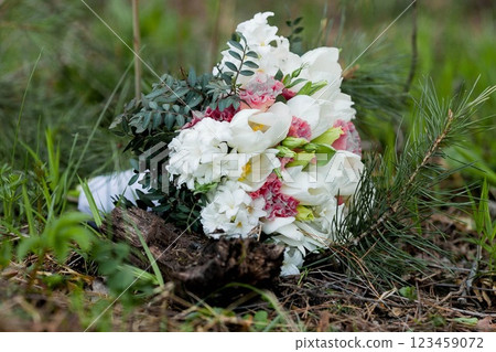 Bridal bouquet on a tree stump in nature Bridal bouquet on a tree stump in nature 123459072