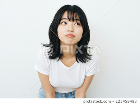 A young woman with a pouting face and cute gestures (AI-generated image) 123459488