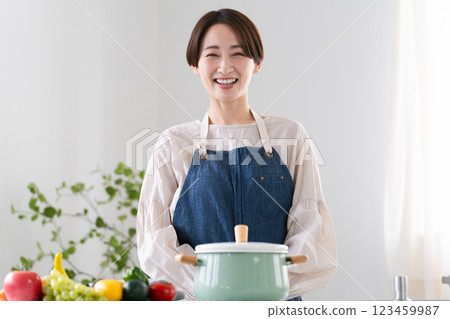 Young woman in apron lifestyle image Young woman in apron lifestyle image 123459987