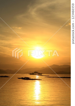 A ferry sailing through the Seto Inland Sea at dusk 123460359