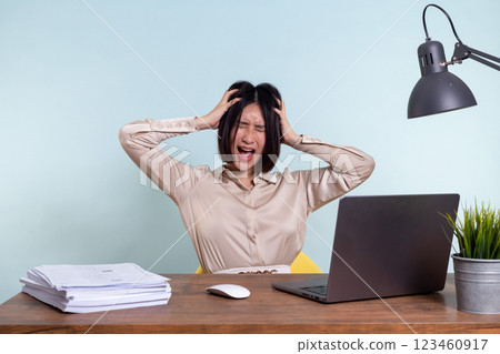 Tired, exhausted Asian woman with a laptop, problems with the project, feeling depressed, laziness in office 123460917