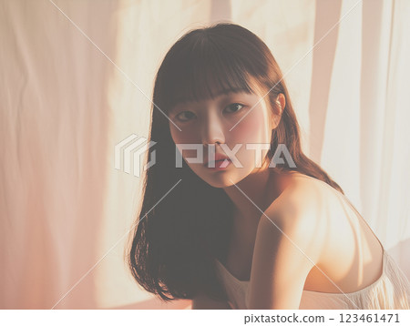 AI-generated image: Portrait of a young woman looking back in sunlight 123461471