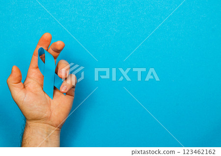 Symbolic blue ribbon representing awareness for cancer detection and prevention 123462162