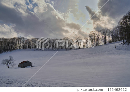 Snowy hills and winter clouds at dusk Snowy hills and winter clouds at dusk 123462612