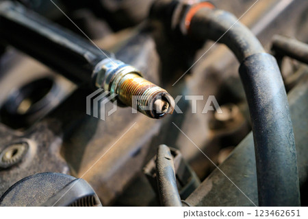 Spark plugs for gasoline engines that are old and have expired will cause incomplete combustion in the engine, in soot and dirt. Changing spark plugs can maintain and extend the life of the engine 123462651