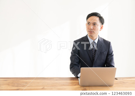Businessman watching personal computer Businessman watching personal computer 123463093