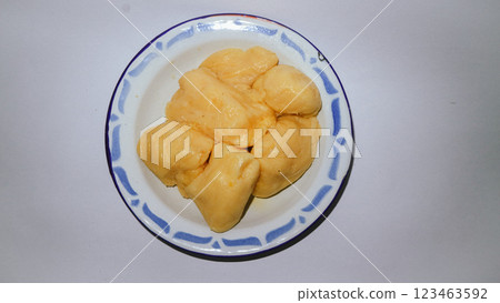 Cassava tape or tapai cassava on a plate with white background 123463592