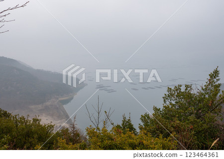 Beautiful sea shrouded in dawn mist at Sakomon in Setouchi city, Okayama prefecture, Japan Beautiful sea shrouded in dawn mist at Sakomon in Setouchi city, Okayama prefecture, Japan 123464361