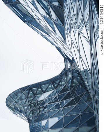Glass facade Steel curve frame Modern building blue reflection Architecture details Futuristic background Glass facade Steel curve frame Modern building blue reflection Architecture details Futuristic background 123464515
