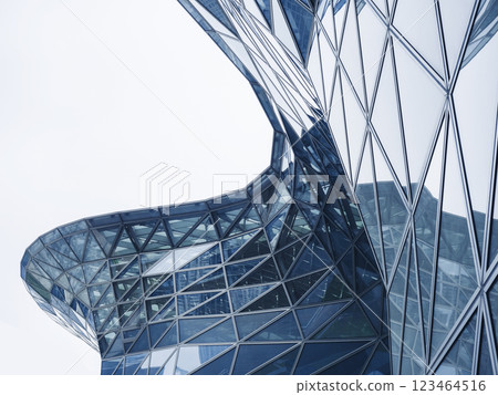 Glass facade Steel curve frame Modern building blue reflection Architecture details Futuristic background 123464516