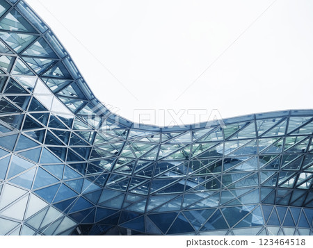 Steel curve Glass facade Modern building blue reflection Architecture details Futuristic background 123464518